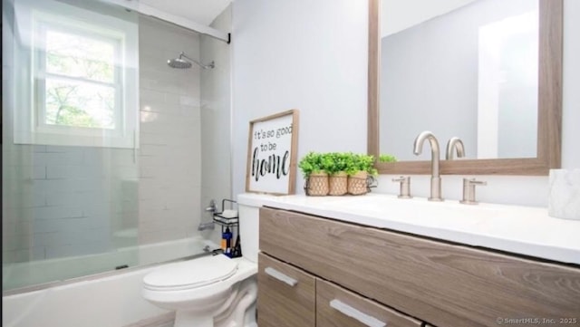 full bathroom featuring vanity, toilet, and combined bath / shower with glass door