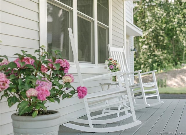 wooden terrace featuring covered porch