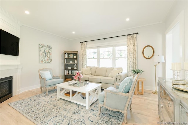 living room featuring crown molding and light wood-type flooring