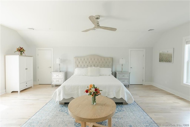 bedroom featuring vaulted ceiling, ceiling fan, and light hardwood / wood-style flooring