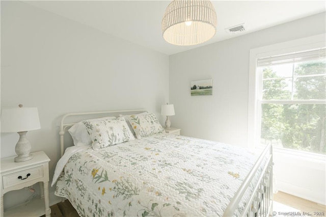 bedroom with light hardwood / wood-style flooring