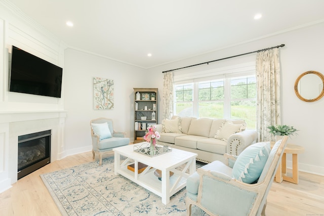 living room featuring crown molding and light hardwood / wood-style flooring