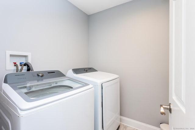 laundry room featuring washing machine and dryer