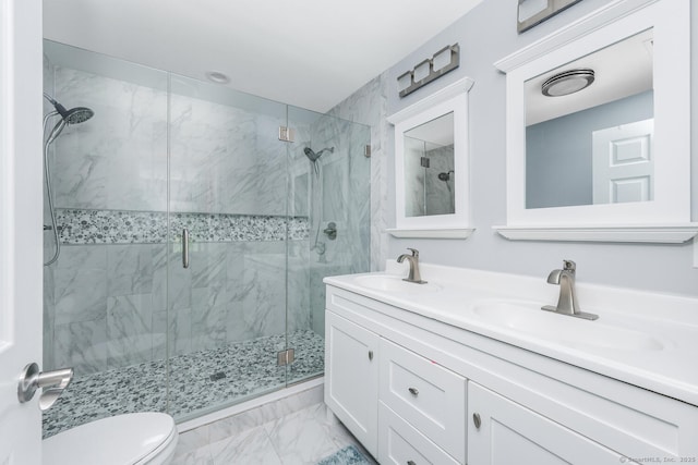 bathroom with walk in shower, vanity, and toilet