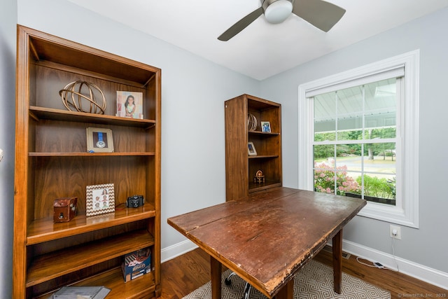 office space featuring dark wood-type flooring and ceiling fan