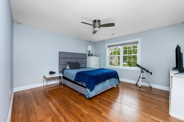 bedroom featuring hardwood / wood-style floors and ceiling fan