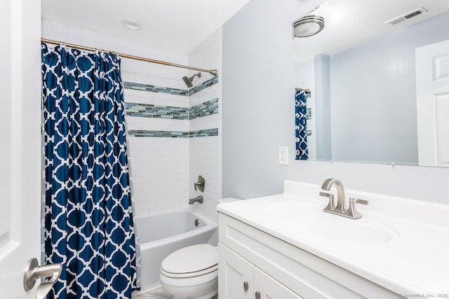 full bathroom featuring vanity, shower / tub combo, and toilet