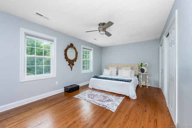 bedroom with wood-type flooring and ceiling fan