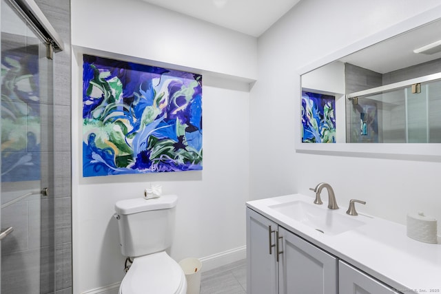 bathroom with walk in shower, vanity, and toilet