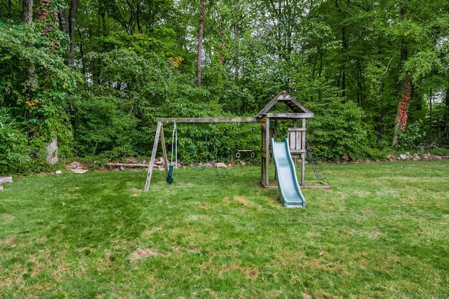 view of jungle gym with a lawn