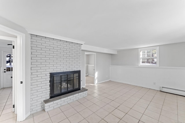 unfurnished living room with light tile patterned flooring, a brick fireplace, and baseboard heating