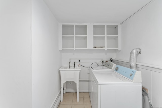 washroom with light tile patterned flooring and independent washer and dryer