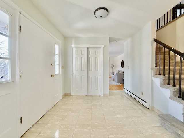 foyer entrance with baseboard heating