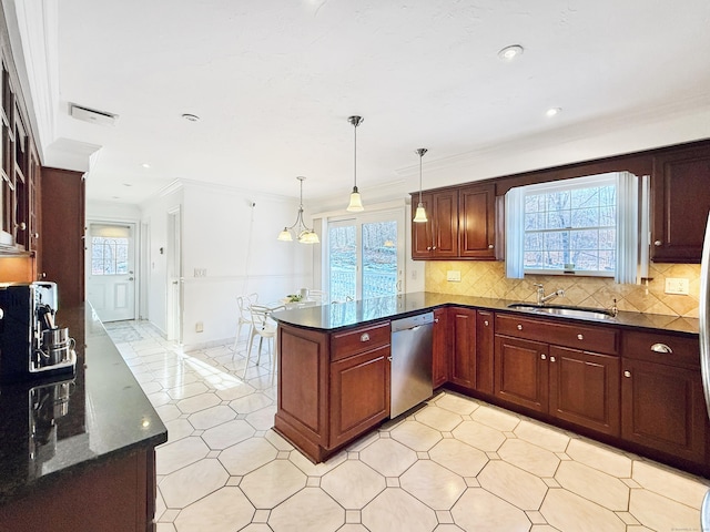 kitchen with sink, dishwasher, hanging light fixtures, ornamental molding, and kitchen peninsula