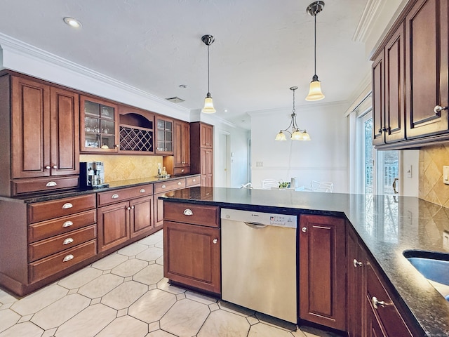 kitchen with pendant lighting, ornamental molding, dishwasher, and dark stone countertops