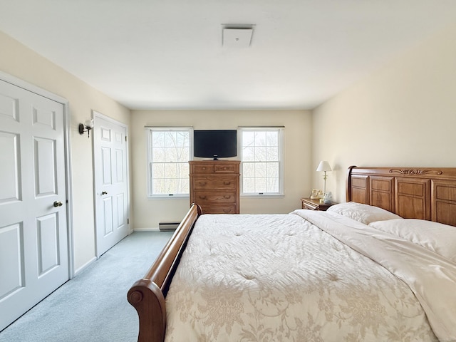 bedroom featuring light carpet