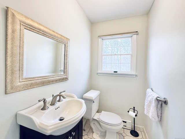 bathroom with vanity, tile patterned floors, and toilet