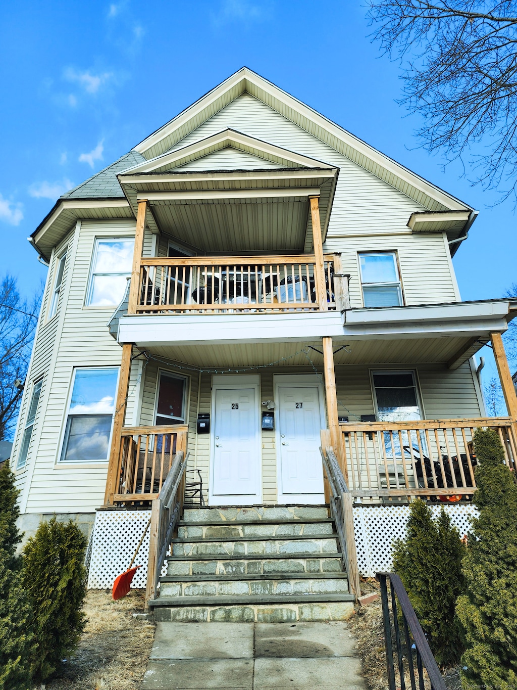 view of front of home with a balcony and covered porch