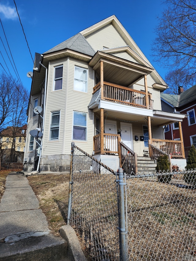 view of front of home with a balcony and a porch