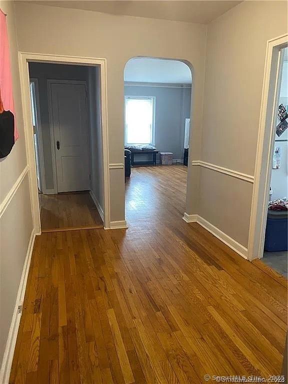 hallway featuring wood-type flooring