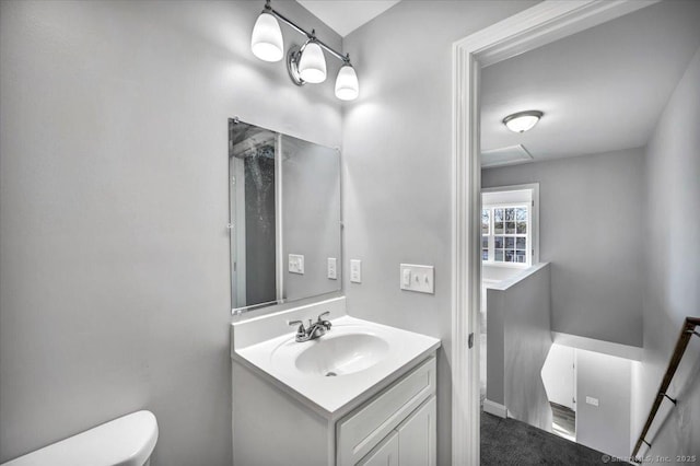 bathroom with vanity and toilet