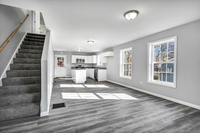 unfurnished living room with light wood-type flooring