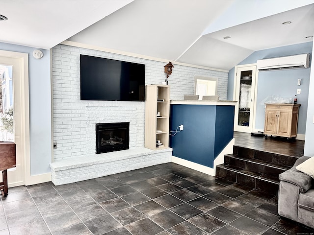 living room featuring a fireplace, vaulted ceiling, a wall mounted AC, and brick wall