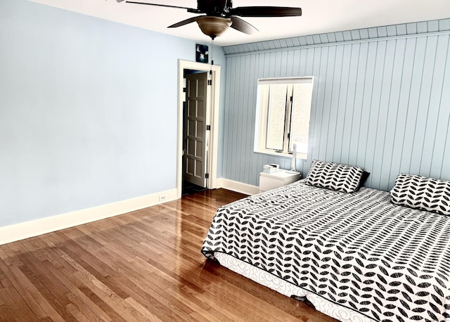 bedroom featuring hardwood / wood-style floors and ceiling fan