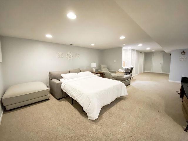 bedroom with light colored carpet