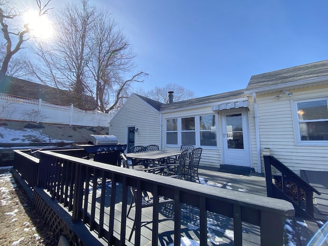 snow covered deck with grilling area