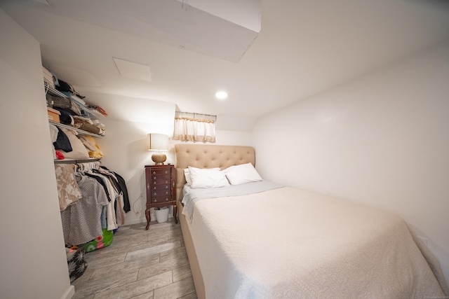 bedroom with light hardwood / wood-style floors