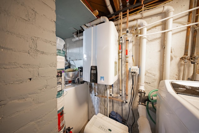 utility room featuring washer / clothes dryer and water heater