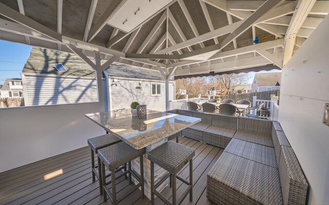 wooden deck with a gazebo and an outdoor hangout area