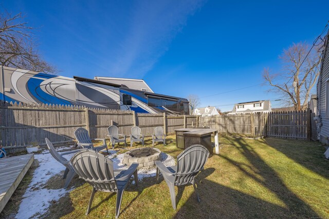 view of yard with a fire pit