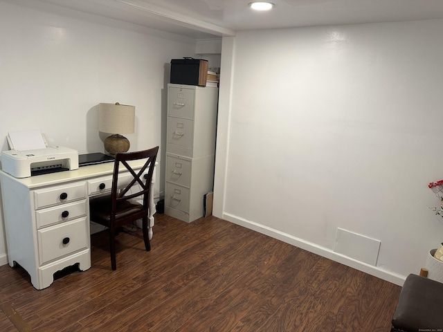 home office with dark wood-type flooring