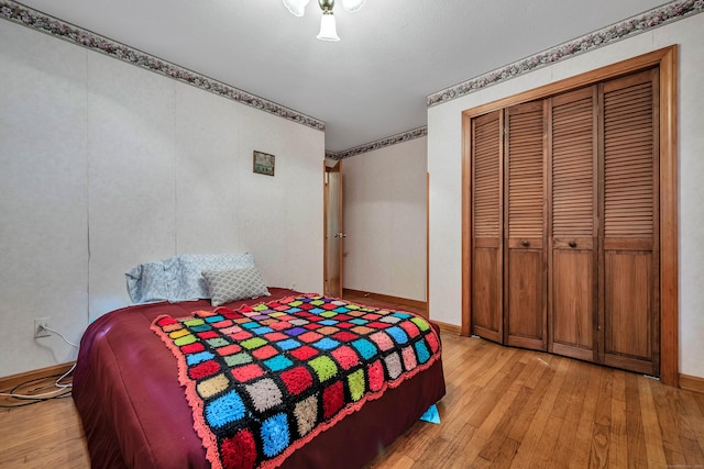 bedroom featuring a closet and light wood-type flooring