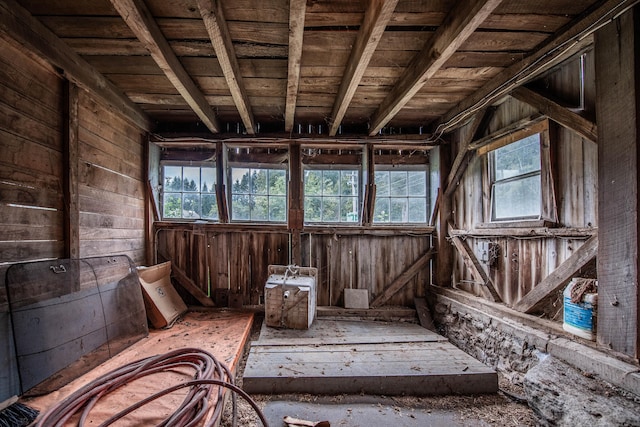 miscellaneous room with wood ceiling and wood walls