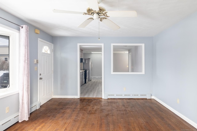 foyer featuring ceiling fan, a baseboard heating unit, and dark hardwood / wood-style floors