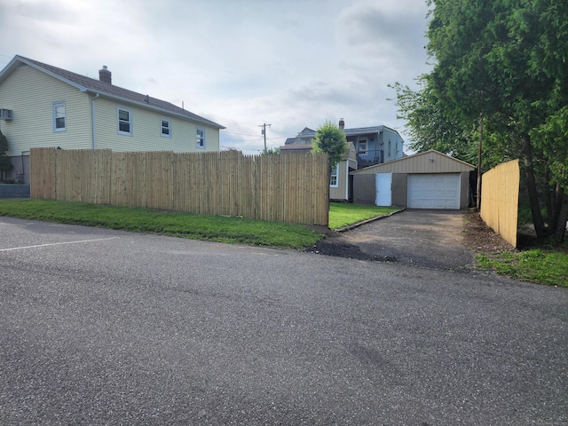 79 Addison St, Waterbury, CT 06708 - view of front facade featuring an outbuilding, driveway, and a detached garage