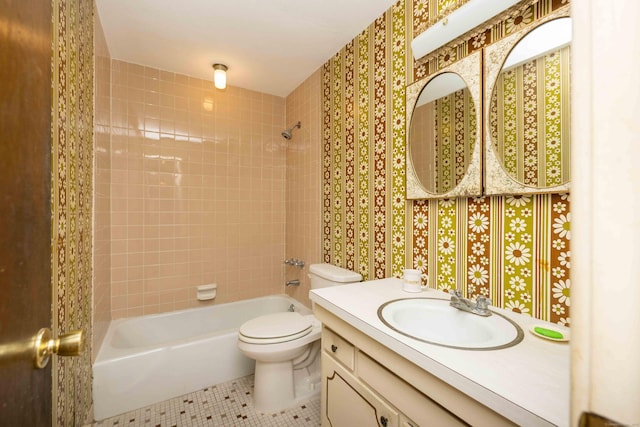 full bathroom with tile patterned flooring, vanity, toilet, and tiled shower / bath