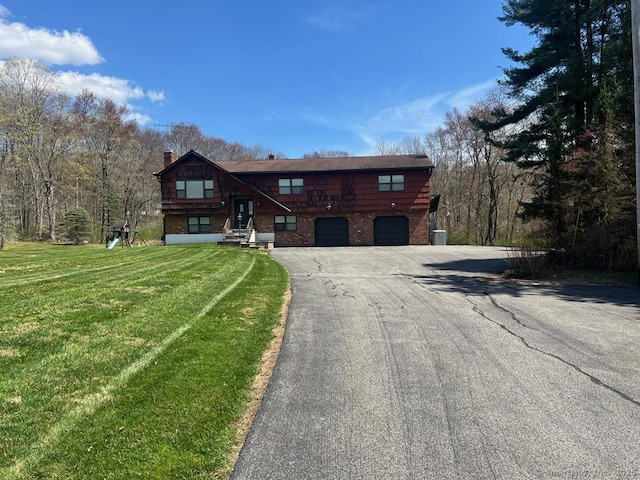 62 Rte 6n Rte, Carmel, NY 10541 - view of front of property featuring an attached garage, driveway, a front lawn, and brick siding