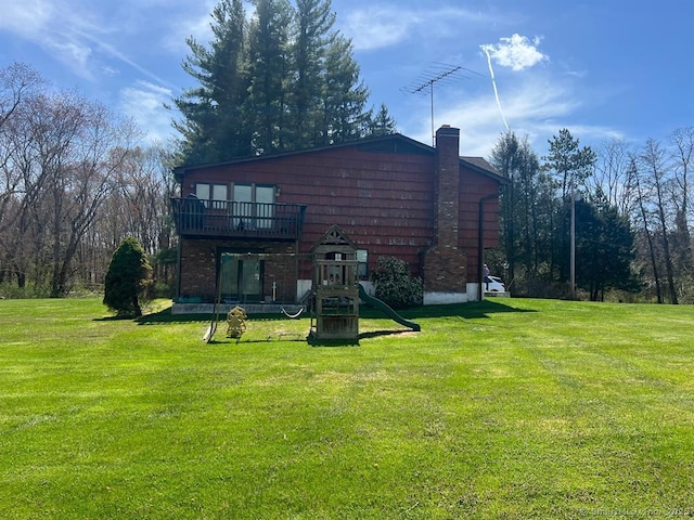 62 Rte 6n Rte, Carmel, NY 10541 - rear view of property featuring a yard, a chimney, and a playground