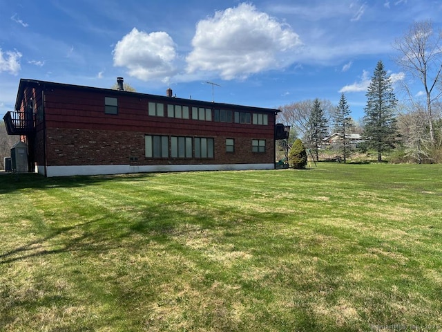 62 Rte 6n Rte, Carmel, NY 10541 - rear view of house featuring a yard and brick siding