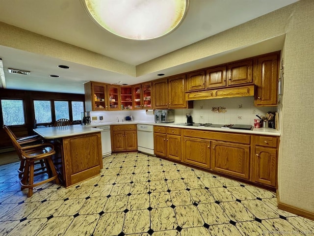 62 Rte 6n Rte, Carmel, NY 10541 - kitchen with white dishwasher, light countertops, a breakfast bar, and visible vents