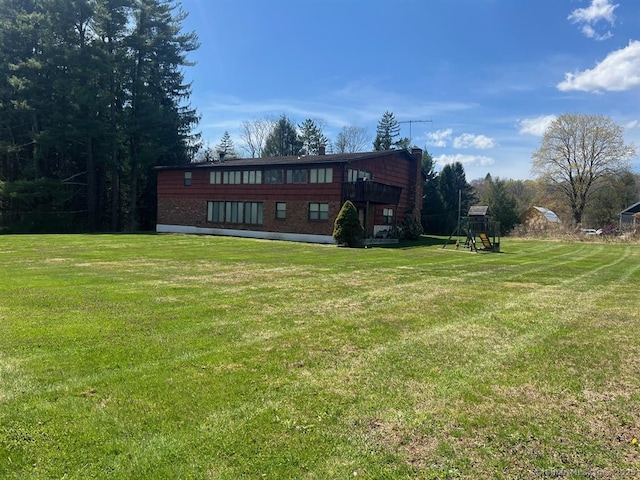 62 Rte 6n Rte, Carmel, NY 10541 - back of house with brick siding, a yard, and playground community