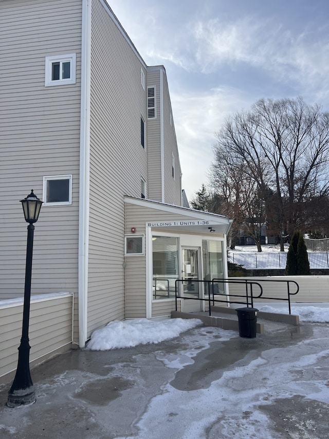 view of side of property featuring fence