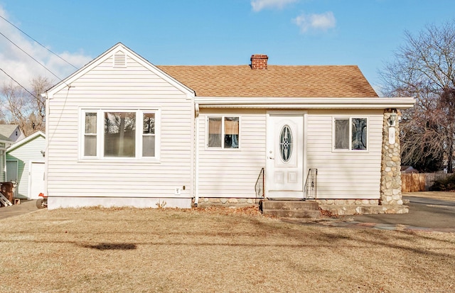 view of front of home with a front yard