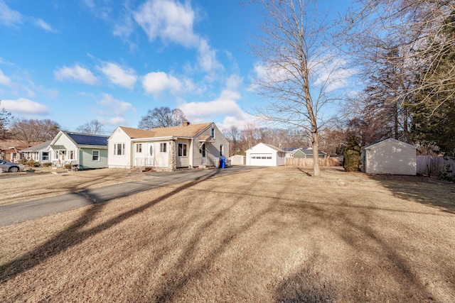 ranch-style house featuring a shed and a garage