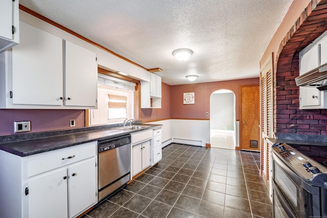 kitchen featuring white cabinetry, a baseboard heating unit, stainless steel dishwasher, and range with two ovens