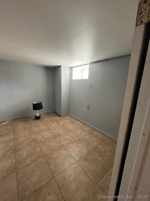 laundry room with light tile patterned flooring